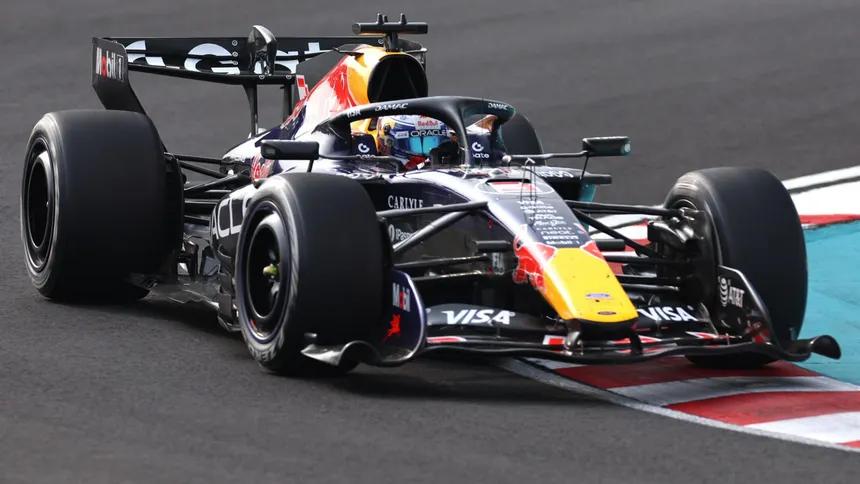 Red Bull Racing pit crew readying the Formula 1 car during an intense race event.